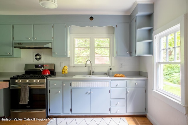 654 Watson Hollow Rd, West Shokan, NY 12494 - kitchen featuring stainless steel gas range oven, under cabinet range hood, light countertops, plenty of natural light, and ornamental molding