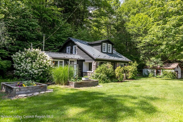 654 Watson Hollow Rd, West Shokan, NY 12494 - back of house with a vegetable garden, a yard, and a metal roof