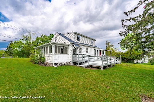 334 Joslen Blvd, Hudson, NY 12534 - back of house featuring a wooden deck and a lawn
