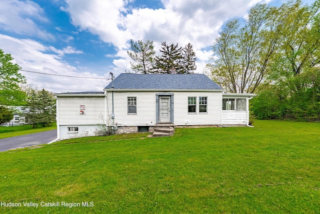 334 Joslen Blvd, Hudson, NY 12534 - view of front of house with a front yard, a chimney, and roof with shingles
