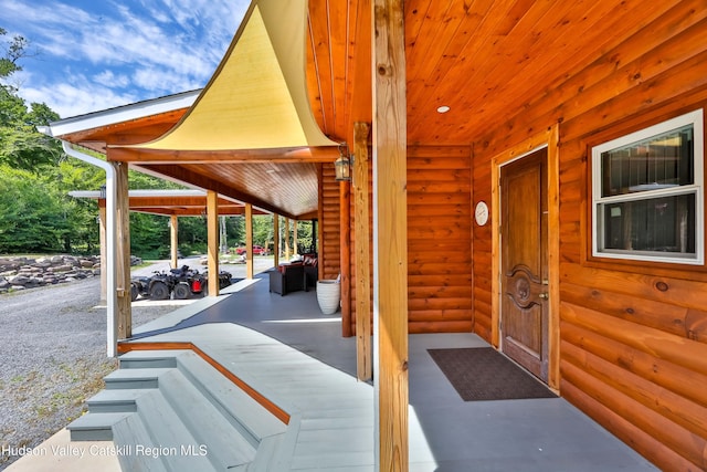 19 Palsgraf Ct, Elka Park, NY 12427 - entrance to property featuring log veneer siding and a porch