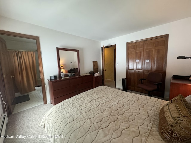 carpeted bedroom with two closets and a baseboard radiator