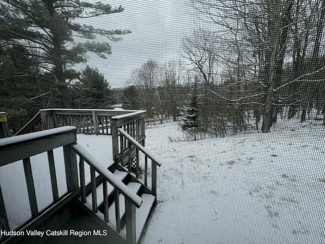 view of snow covered deck