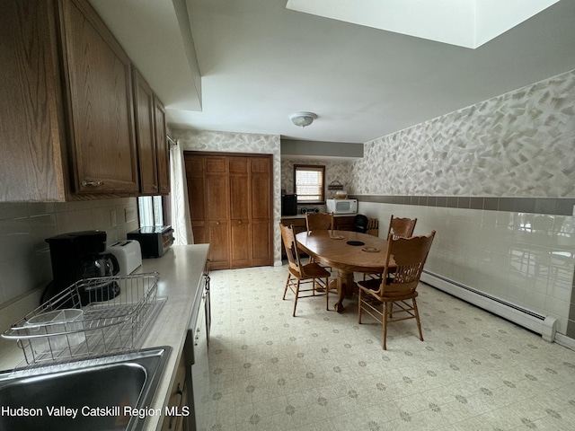 dining room with sink and baseboard heating