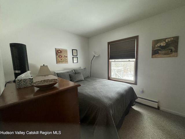 carpeted bedroom with baseboard heating