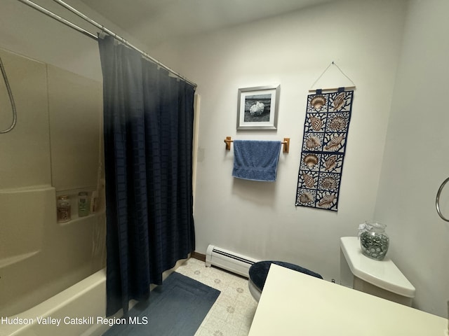 bathroom featuring shower / tub combo, baseboard heating, and toilet