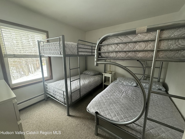 bedroom with a baseboard radiator and carpet flooring