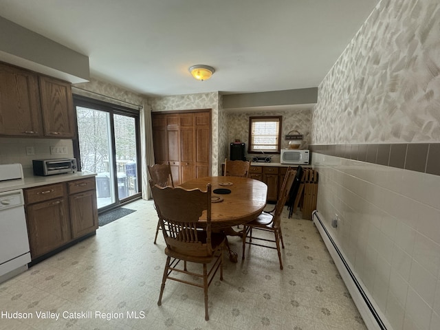 dining area with a baseboard heating unit