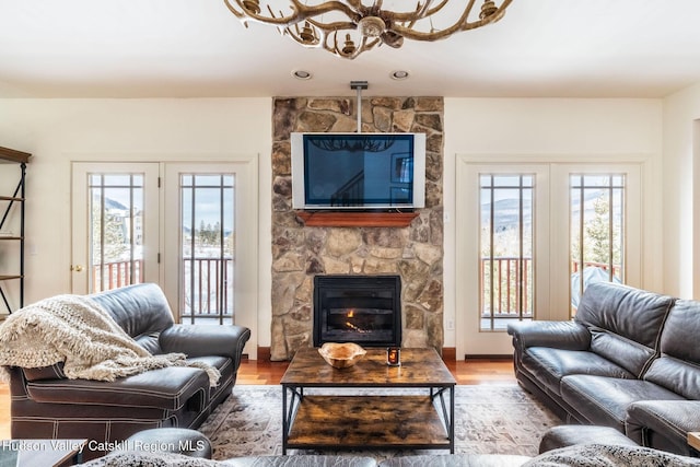 living room featuring hardwood / wood-style flooring and a fireplace