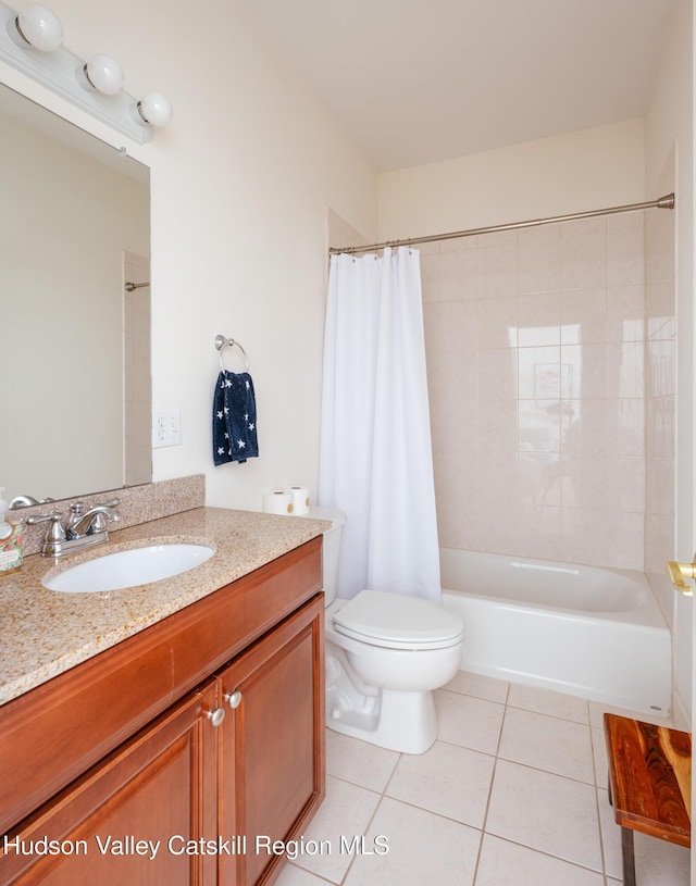 full bathroom with vanity, toilet, tile patterned flooring, and shower / bath combo