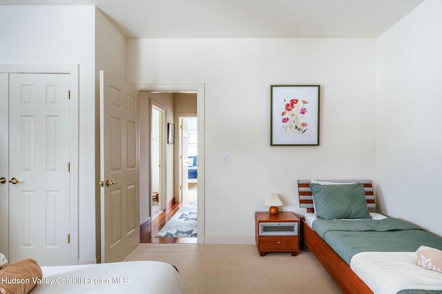 bedroom with light carpet