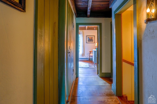 hall with hardwood / wood-style flooring, wooden ceiling, and baseboard heating