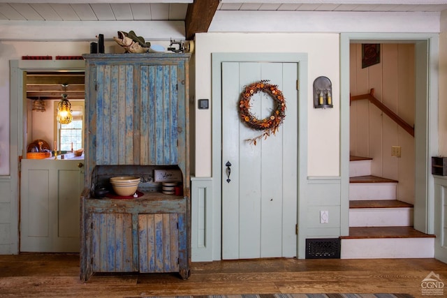 entryway featuring stairs and wood finished floors
