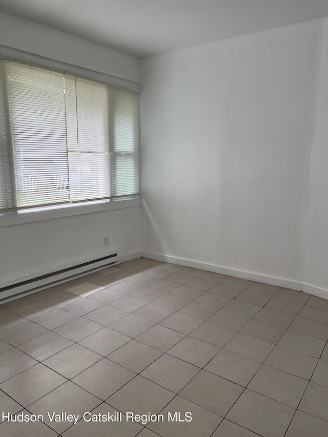 6 Church St, Ellenville, NY 12428 - spare room featuring baseboard heating and light tile patterned flooring