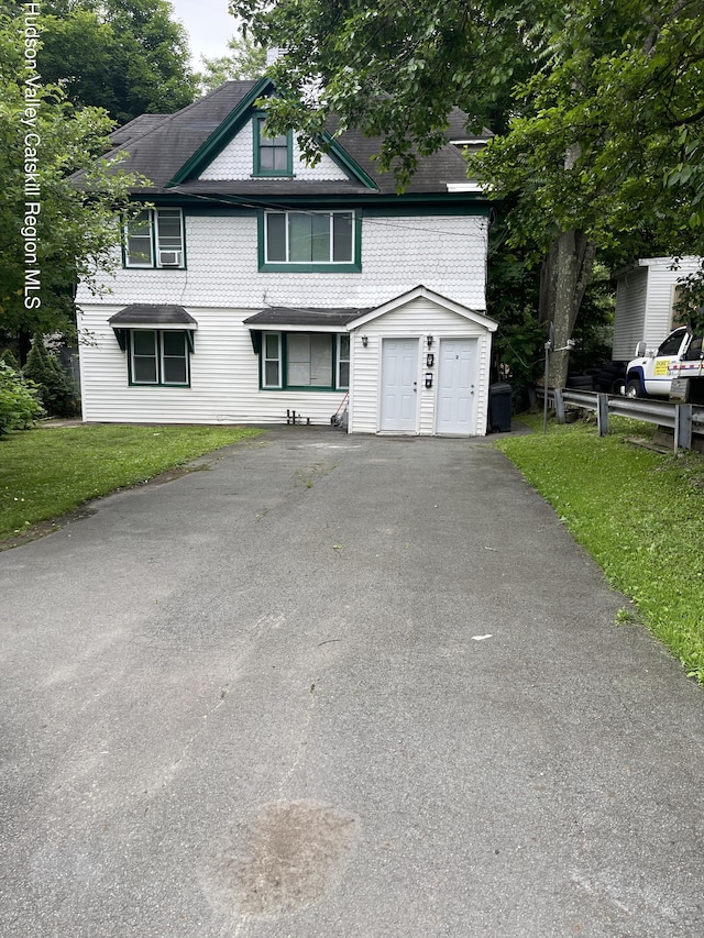 6 Church St, Ellenville, NY 12428 - view of front of home with a front lawn, asphalt driveway, and roof with shingles