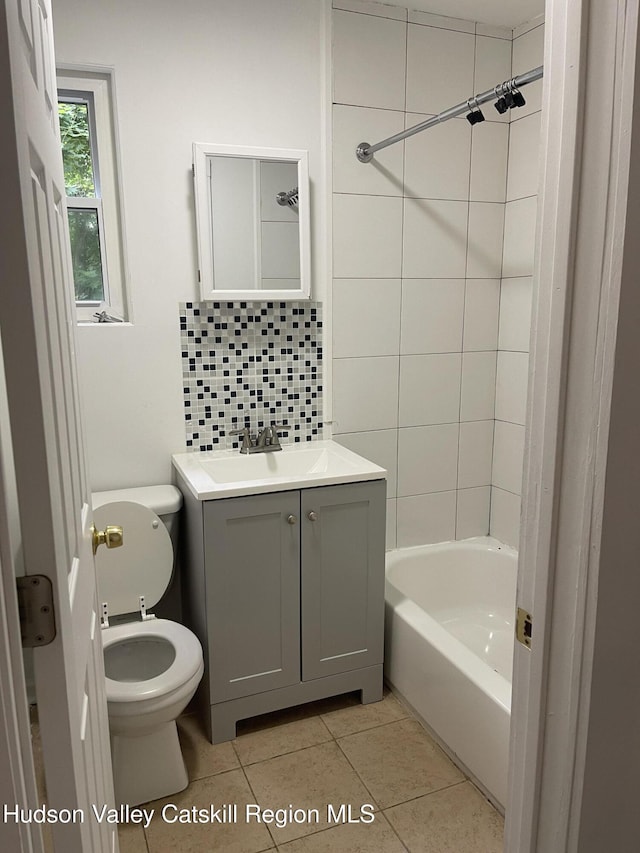 6 Church St, Ellenville, NY 12428 - bathroom with vanity, tile patterned floors, washtub / shower combination, and decorative backsplash