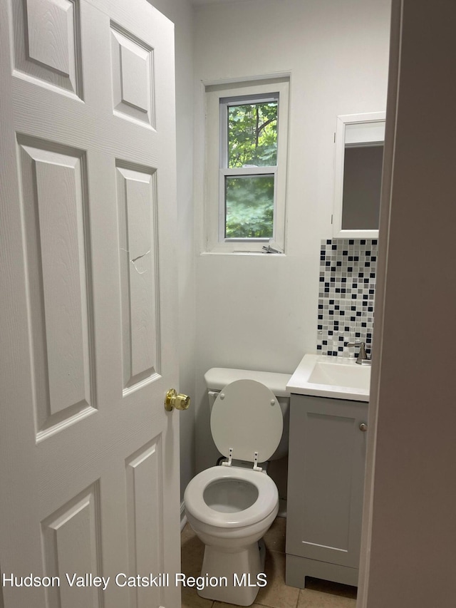6 Church St, Ellenville, NY 12428 - bathroom featuring vanity, backsplash, and tile patterned floors