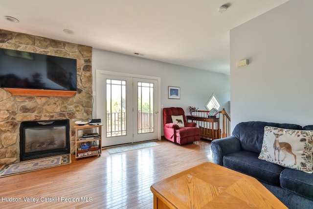 6 Trailside Dr Unit A8, Hunter, NY 12442 - living area featuring wood-type flooring and a stone fireplace