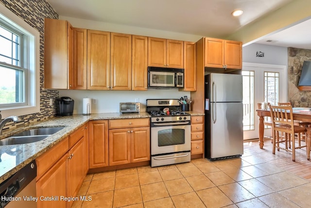 6 Trailside Dr Unit A8, Hunter, NY 12442 - kitchen with appliances with stainless steel finishes, light stone counters, recessed lighting, tasteful backsplash, and light tile patterned floors