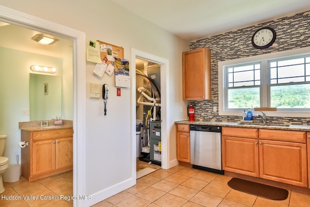 6 Trailside Dr Unit A8, Hunter, NY 12442 - kitchen with dishwasher, light tile patterned floors, backsplash, and light stone countertops