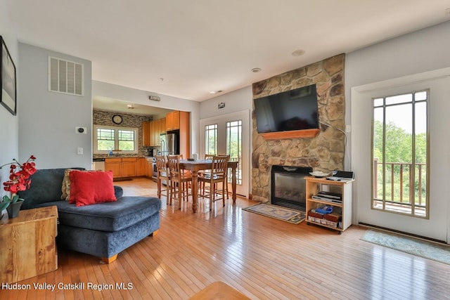 6 Trailside Dr Unit A8, Hunter, NY 12442 - living room with light wood-style floors and a fireplace