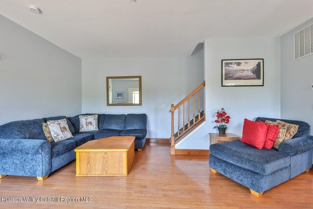 6 Trailside Dr Unit A8, Hunter, NY 12442 - living room featuring wood finished floors and stairway