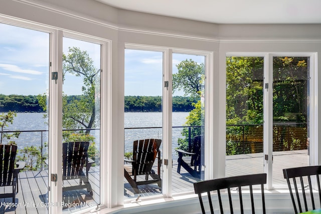 doorway to outside featuring a water view