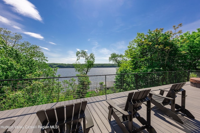 wooden terrace with a water view