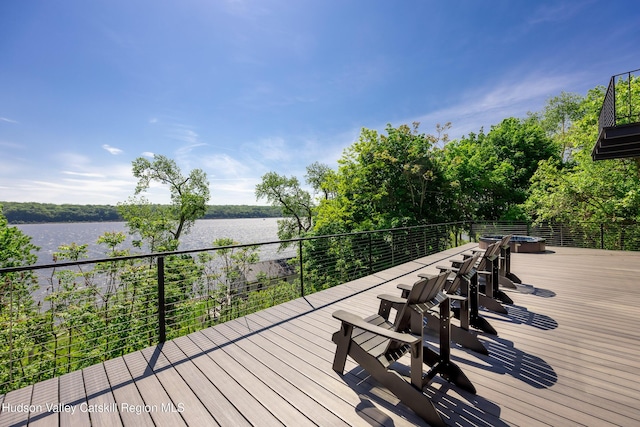 wooden deck with a water view