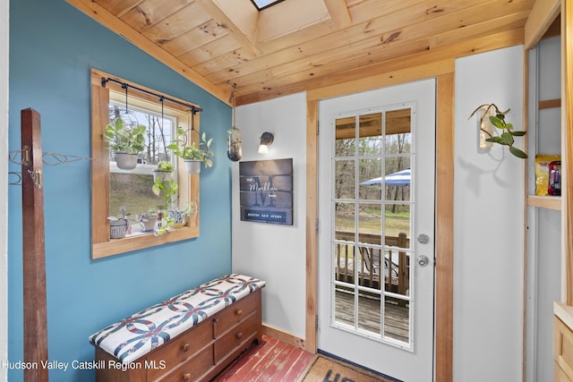 entryway with baseboards, plenty of natural light, and wooden ceiling