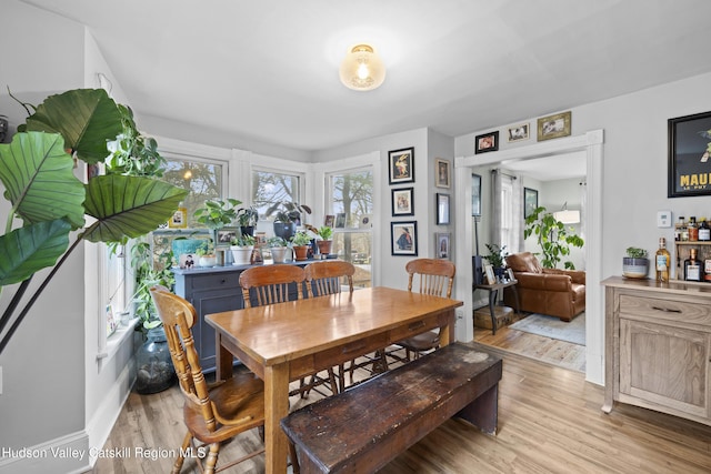 dining area featuring light wood-style flooring