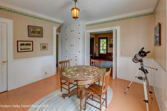 3721 Ridge Rd, Hamden, NY 13782 - dining space with wainscoting, wood finished floors, crown molding, and wood walls