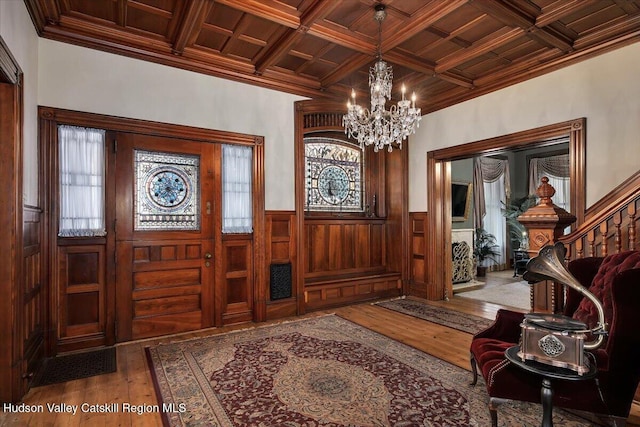 1 Waddell Ave, Fort Plain, NY 13339 - foyer entrance featuring a chandelier, ornamental molding, coffered ceiling, hardwood / wood-style flooring, and wooden ceiling