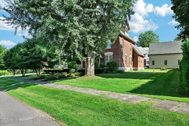 1 Waddell Ave, Fort Plain, NY 13339 - view of side of property with a yard and brick siding