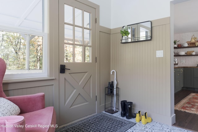 doorway with hardwood / wood-style floors