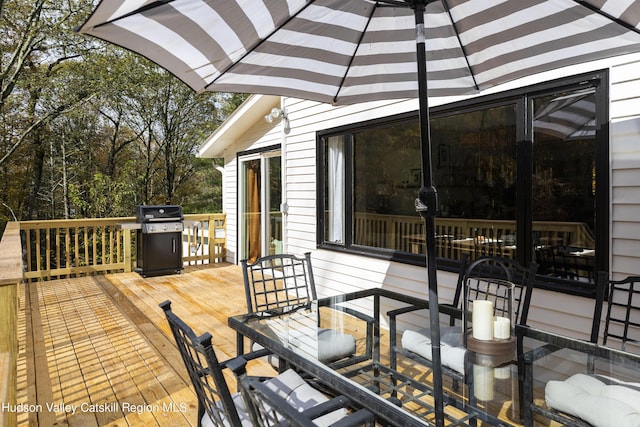 wooden terrace with area for grilling