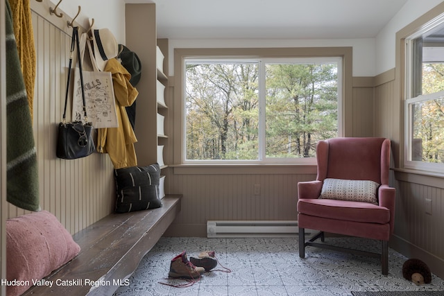 mudroom featuring plenty of natural light and baseboard heating