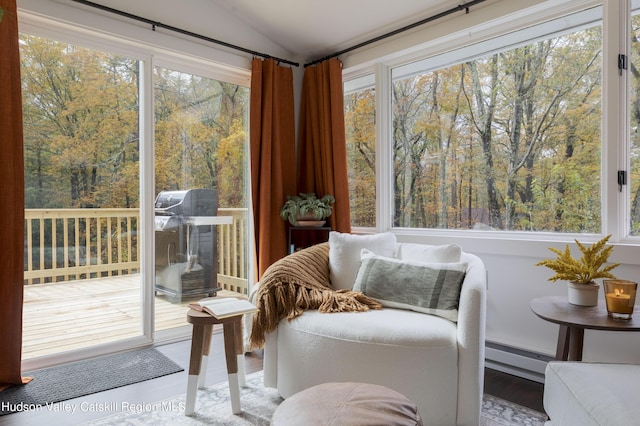 sunroom featuring a wealth of natural light and lofted ceiling