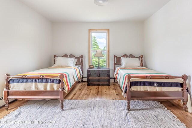 39 Middle St, East Branch, NY 13756 - bedroom featuring wood finished floors and baseboard heating