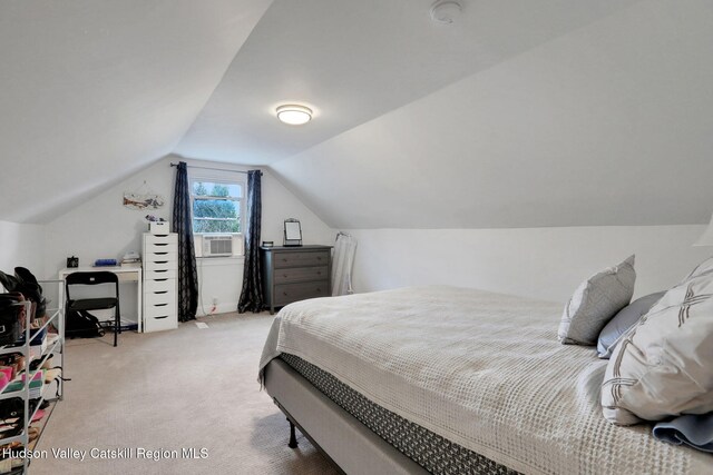 bedroom with cooling unit, light colored carpet, and lofted ceiling
