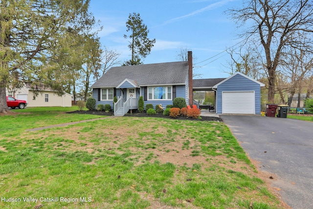 view of front facade featuring a chimney, a shingled roof, aphalt driveway, and a front lawn