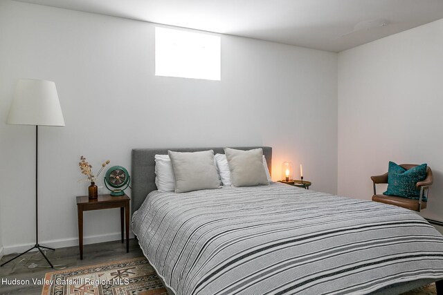 bedroom featuring dark wood-type flooring