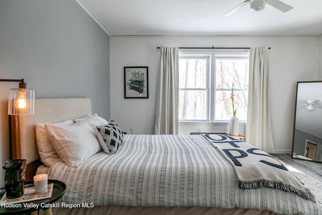 bedroom featuring hardwood / wood-style floors and ceiling fan