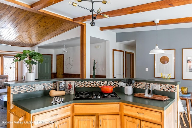 kitchen with light brown cabinetry, decorative backsplash, lofted ceiling with beams, and black gas cooktop