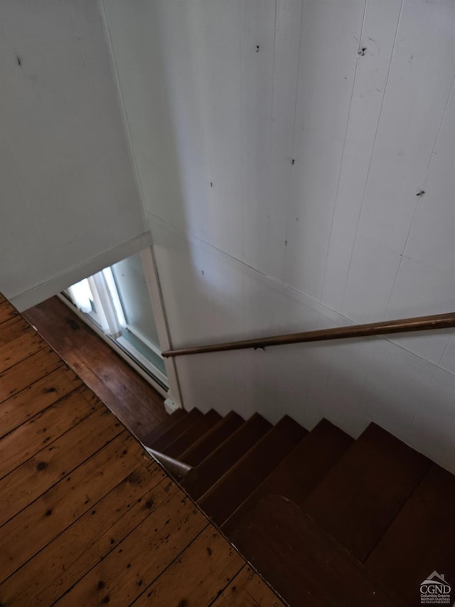 stairway featuring hardwood / wood-style flooring