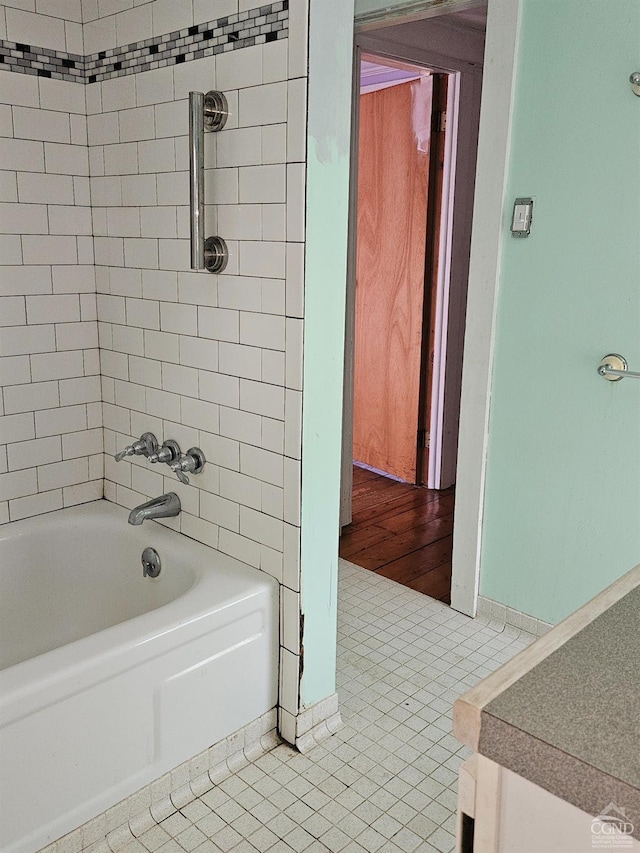 bathroom featuring tile patterned floors and shower / tub combination