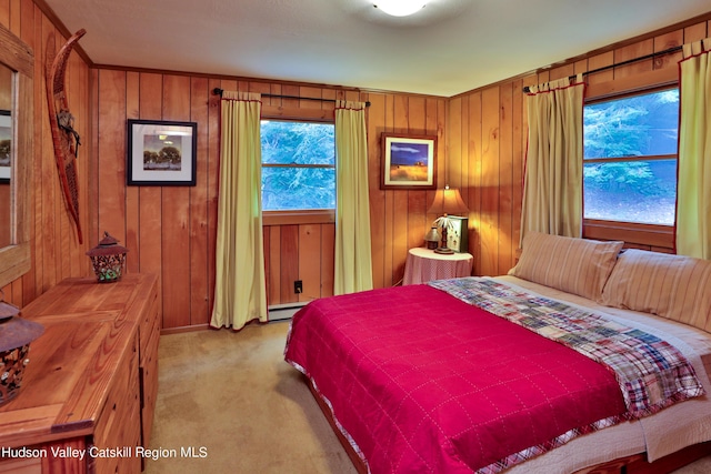 carpeted bedroom with wooden walls and a baseboard radiator