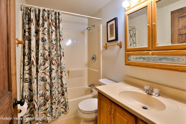 full bathroom featuring vanity, shower / bath combo, and toilet