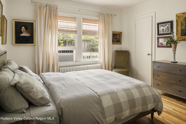 827 Union St, Hudson, NY 12534 - bedroom featuring radiator, wood finished floors, and cooling unit