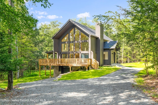 view of front of house featuring a front yard and a deck